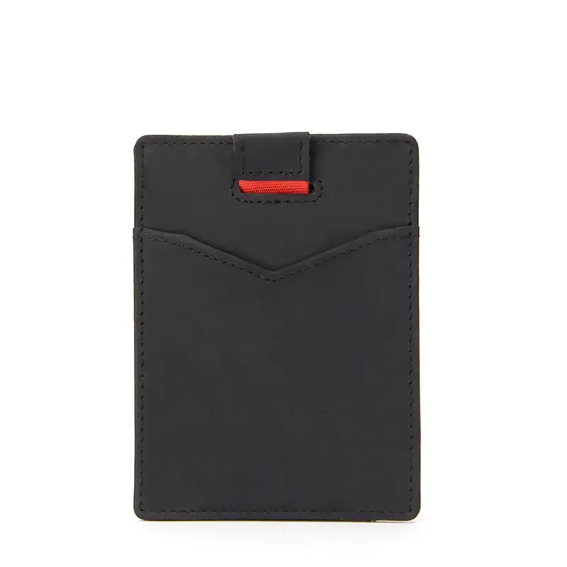 Back of a black pull-tab leather card holder with a visible pocket