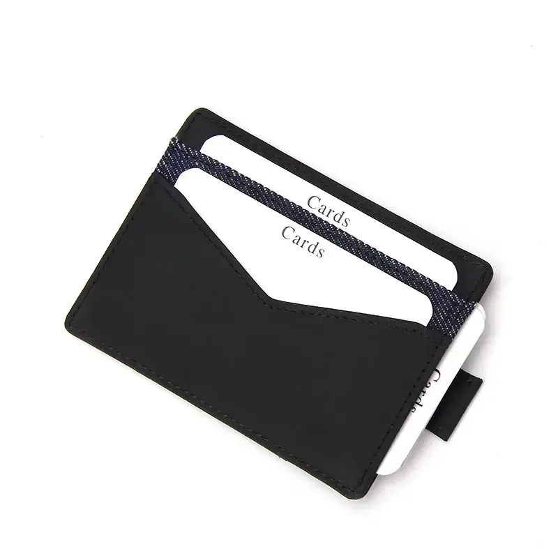 Black slim leather card holder with two cards raised by the pull tab