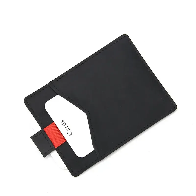 Black leather card holder showing the red pull tab in use