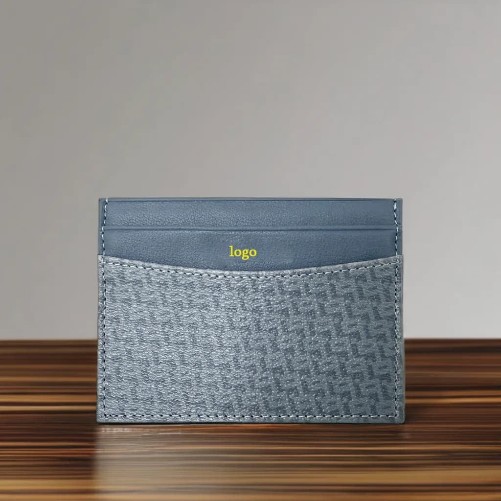 Grey patterned card holder standing on a wood surface