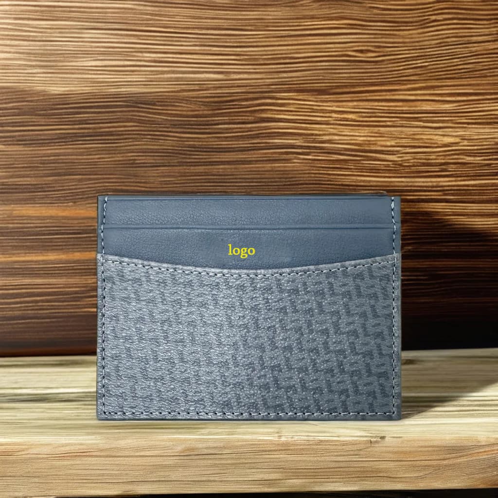 Close view of the patterned panel and leather trim on a slim card holder