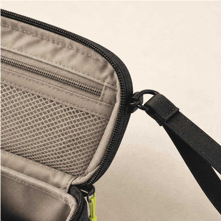 Internal mesh pocket zipper and wrist strap detail