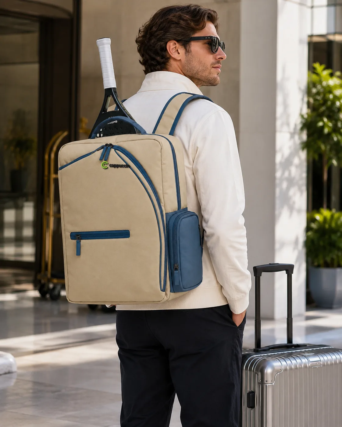 Man carrying Cappuccino PDB017 travel padel backpack with racket and suitcase